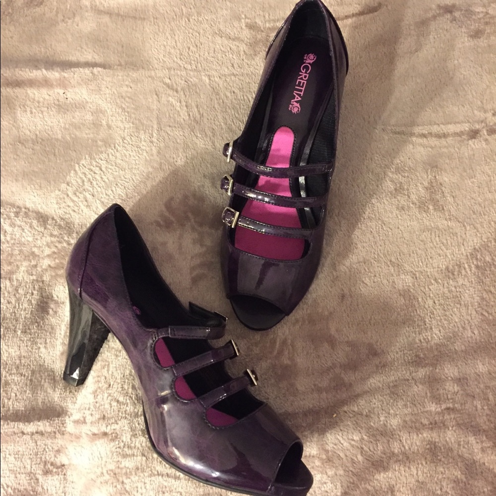 Dark plum patent heels.